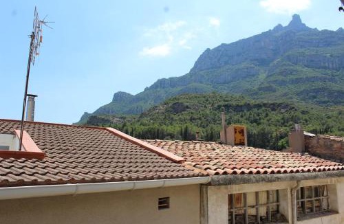 Monistrol de Montserrat Apartment | 3-Story Gaudi Building with Montserrat Stone
